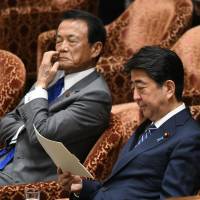 Finance Minister Taro Aso and Prime Minister Shinzo Abe attend a Lower House Budget Committee session Monday, where Aso offered his first public apology about his remarks on the sexual harassment scandal involving former Vice Finance Minister Junichi Fukuda. Taro Aso makes first public apology over Finance Ministry sexual harassment scandal