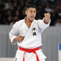 There are growing expectations for Okinawa natives such as Ryo Kiyuna, pictured, who won his sixth-straight men's 'kata' national championship in December, to seize gold in the 2020 Tokyo Olympics. | THE OKINAWA TIMES