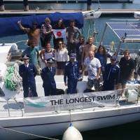 The expedition crew for Ben Lecomte assemble at Yokohama Bayside Marina ahead of his departure from Choshi, Chiba Prefecture, on Tuesday. A 10,000-km swim across the Pacific to spotlight pollution? Ben Lecomte ready to jump in