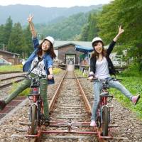 Tourists are seen pedaling a rail bike that runs on the abandoned Kamioka Railway in Hida, Gifu Prefecture. All aboard: Exploring Japan's abandoned train lines