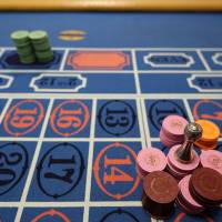 Crunching the numbers: Gaming chips sit stacked on a roulette table at Japan Casino School in Tokyo. Bloomberg Place your bets: Local governments in Japan weigh the benefits of applying for a casino license