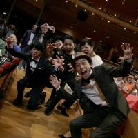 A ghastly treat: Shinichiro Ueda (front) and the cast of zombie flick “One Cut of the Dead” ham it up for the cameras at this year’s Udine Far East Film Festival in Italy. Udine film festival can teach Japanese directors a few things about international appeal
