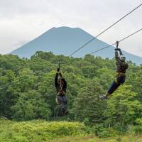 Taking the plunge: At 1.4-kilometers long, the zip-line course at Pure in Niseko Village is the longest in Japan. Beat the heat with summer sports in Niseko