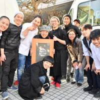 Fishing for change: Chefs for the Blue assembled at their food cart event at UNU Tokyo. Chef Shinsuke Ishii is left of center in white and founding-member Hiroko Sasaki can be seen third from right in a puffer jacket. Calling on chefs to lead the charge against overfishing