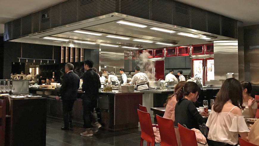Open air theater: Watch as the chefs prepare the food in Test Kitchen H’s vast kitchen. Test Kitchen H