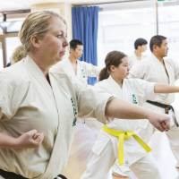 Ulrika Yui practises karate alongside her daughter, Runoa, and her husband, Satoshi. Swedish life coach channels force of positive thinking