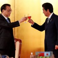 Chinese Premier Li Keqiang and Prime Minister Shinzo Abe toast at an event May 10 to celebrate the 40th anniversary of the peace and friendship treaty between China and Japan and to welcome Li in Tokyo. Japan-China relationship is on the mend