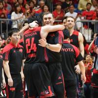 Alvark coach Luka Pavicevic, seen embracing team leader Daiki Tanaka on Saturday, guided the club to a B. League title in his first season at the helm. Luka Pavicevic's system was key to Alvark Tokyo's title run