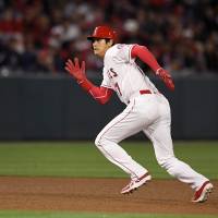 Shohei Ohtani runs to third base on a Luis Valbuena grounder during the Angels’ 3-2 win over the Orioles on Tuesday. Shohei Ohtani doubles in return to action; Angels beat Orioles