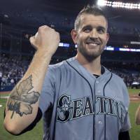 Seattle’s James Paxton shows off his maple leaf tattoo after throwing a no-hitter in the Mariners’ 5-0 win over the Blue Jays on Tuesday in Toronto. Canadian James Paxton tosses no-hitter for Mariners in Toronto