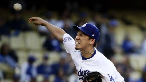Los Angeles starter Kenta Maeda pitches against Colorado in the first inning on Wednesday. Dodgers' Kenta Maeda fans 12 in impressive outing