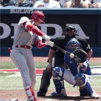 Los Angeles designated hitter Shohei Ohtani lashes a double against Toronto in the third inning on Thursday. Ohtani reaches base four times in rout of Jays