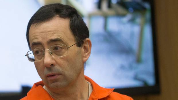 Former Michigan State University and USA Gymnastics Dr. Larry Nassar appears in court for his final sentencing phase in Eaton County Circuit Court in Charlotte, Michigan, Feb. 5. The Michigan university where serial sex abuser Nassar practiced medicine announced Wednesday it has agreed to a $500 million settlement with hundreds of former victims of the USA Gymnastics doctor. Michigan State University reaches 'global settlement' with Larry Nassar's victims for $500 million