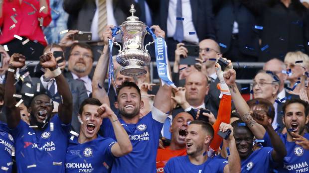 Chelsea players celebrate after defeating Manchester United to win the F.A. Cup on Saturday in London. Chelsea ends year on high with F.A. Cup title