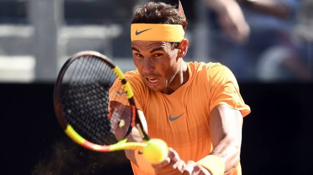 Rafael Nadal hits a return during his semifinal match against Novak Djokovic in the Italian Open on Saturday in Rome. Nadal gets best of rival Djokovic to reach Italian Open final