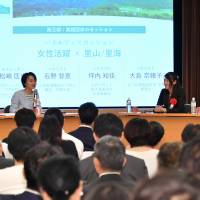Participants discuss their activities and roles in their respective satoyama and satoumi fields on a panel at the Japan Times Satoyama Consortium symposium in Tokyo on May 16. YOSHIAKI MIURA Women's panel shares insights