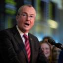 New Jersey Gov. Phil Murphy speaks on Thursday before placing a bet at the Monmouth Park Sports Book on the first day of legal sports betting in the state, in Monmouth, New Jersey.