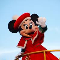Minnie Mouse, wearing a red coat, waves during a daytime parade at Tokyo Disneyland in Urayasu, Chiba Prefecture, in December 2012. Under a special deregulation project, the prefecture is now considered a possible candidate to operate a casino resort complex. Chiba Prefecture businesses push for casino resort