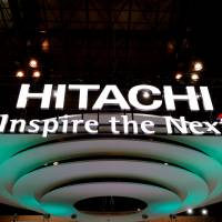 The Hitachi Ltd. logo is displayed at a technology fair in the Makuhari Messe convention center in Chiba Prefecture in October 2016. British government, Hitachi to begin full negotiations on nuclear plant in Wales