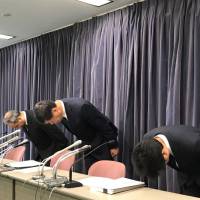 Prince Hotel President Masahiko Koyama (center) apologizes at a news conference in Tokyo’s Chiyoda Ward on Tuesday after customer data was stolen from its official foreign website. Prince Hotels hack results in loss of 124,000 customers' credit card numbers, other data