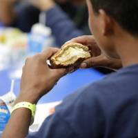 A child eats at an unaccompanied alien children program shelter in Brownsville, Texas, in this undated handout photo obtained by Reuters Sunday. Democrats rush to border to slam Trump-initiated family separations, visit 'tent city' for kids