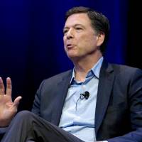 Former FBI director James Comey speaks during a stop on his book tour in Washington in April. Comey is about to get dinged in an internal review by the Justice Department, and President Donald Trump says he can’t wait. Report on FBI's Clinton email probe and James Comey's statements coming next week