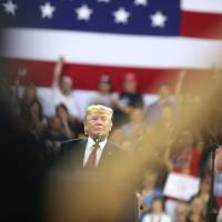U.S. President Donald Trump pauses while speaking onstage during a rally in Duluth, Minnesota, Wednesday. Fox chides rivals for not airing Trump speech at campaign-style rally live