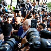 Malaysia’s former Prime Minister Najib Razak arrives to give a statement to the Malaysian Anti-Corruption Commission (MACC) in Putrajaya on May 22. Australia was 'complicit' in Malaysian corruption, Anwar Ibrahim charges
