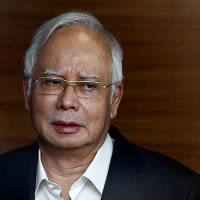 Former Malaysian Prime Minister Najib Razak arrives to give a statement to the Malaysian Anti-Corruption Commission (MACC) in Putrajaya, Malaysia, on May 24. Malaysia seeks to lay multiple charges against former Prime Minister Najib Razak over 1MDB