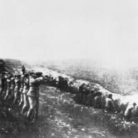 A photo taken from the body of a dead Nazi officer killed in Russia, shows a German firing squad shooting Soviet civilians in the back as they sit beside their own mass grave, in Babi Yar, northwest of Kiev, in 1942. Nazi death squads focus of latest war crime cases in Germany