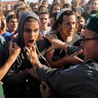 Israeli settlers scuffle with Israeli security forces at the Netiv Haavot settlement, near Bethlehem, in the occupied West Bank onTuesday. Fifteen Israeli settler families are expected to evacuate their homes in this outpost after it was declared illegal by the Israeli High Court. Israel police evict wildcat settlers as deadline looms