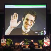 Edward Snowden appears on a live video feed broadcast from Moscow at an event sponsored by ACLU Hawaii in Honolulu in 2015. Snowden blew the lid off U.S. government surveillance methods five years ago. The 34-year-old is living in exile in Russia, but intelligence chiefs complain that revelations from the trove of classified documents he disclosed keep trickling out. From Japan surveillance to bitcoin snooping, Edward Snowden's leaks still trickling out, vexing U.S. five years on