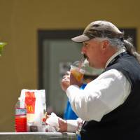 A customer enjoys a sugary drink at a fast food restaurant in San Francisco, California, U.S., on July 20, 2011. The U.S. has torpedoed a plan to recommend higher taxes on sugary drinks, forcing a World Health Organization panel to back off the U.N. agency’s previous call for such taxes as a way to fight obesity, diabetes and other life-threatening conditions. U.S. blocks U.N. health panel from backing taxes on sugary drinks
