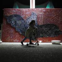 A child plays beside a message board adorned with notes for loved ones who took their own lives during an Out of the Darkness Walk event organized by the Cincinnati Chapter of the American Foundation for Suicide Prevention at Sawyer Point Park in Cincinnati in 2017. Suicide rates inched up in nearly every U.S. state from 1999 through 2016, according to a new government report released Thursday. Sobering report teases out factors leading to suicides as all U.S. states see rise