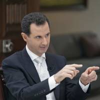 Syrian President Bashar Assad speaks during an interview in Damascus on May 10. Defying the United States, Assad presses assault in southwest Syria