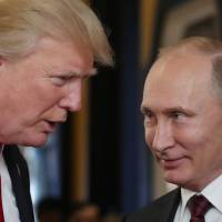 U.S. President Donald Trump (left) chats with Russian President Vladimir Putin as they attend the APEC Economic Leaders’ Meeting, part of the Asia-Pacific Economic Cooperation (APEC) leaders’ summit in the central Vietnamese city of Danang, last November. Trump said Thursday he is considering meeting with Russian leader Vladimir Putin and is sending his national security adviser to Moscow to discuss the idea. Trump weighs meeting with Putin, sending John Bolton to Moscow