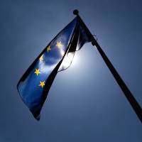 A European Union flag outside the EU Commission headquarters in Brussels Tech firms may have to filter user uploads under new EU rules