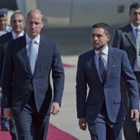 Jordanian Crown Prince Hussein (right) receives Britain’s Prince William after his arrival at Marka Airport in Amman Sunday. Prince William has kicked off a politically delicate five-day tour of Jordan, Israel and the Palestinian territories. He plans to meet with young people, refugees and political leaders in a tumultuous region Britain had controlled between the two world wars. Prince William on historic Mideast trip, praises U.K.-Jordan ties