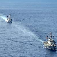 U.S. Navy ships sail in the South China Sea in July 2014. The U.S. and Japan will conduct their first joint antiship combat drills during the Rim of the Pacific (RIMPAC) multinational naval exercises in Hawaii from June 27 to Aug. 2. Japan and U.S. to conduct first joint anti-ship drills