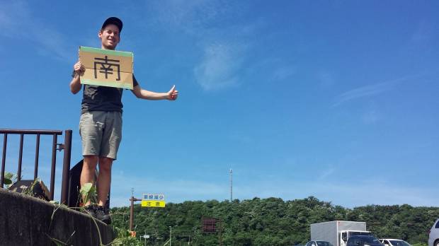 Southward bound: The author faces his first real test of patience, standing beside a road for two hours in Akita Prefecture. Hitchhiking Japan: 5,000 kilometers in the company of strangers
