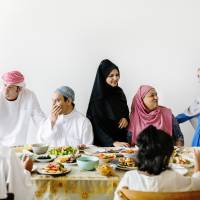 Family and friends gather after morning prayers to celebrate the end of Ramadan. In addition to sharing a lavish meal, many countries follow their own distinct traditions. Getty Images | GETTY IMAGES