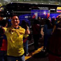 A supporter takes a selfie as the bus carrying Colombia’s national soccer team prepares to leave the Kazan airport, upon arrival on Tuesday ahead of the FIFA World Cup Russia 2018. U.S. counterspy warns World Cup travelers' devices could be hacked