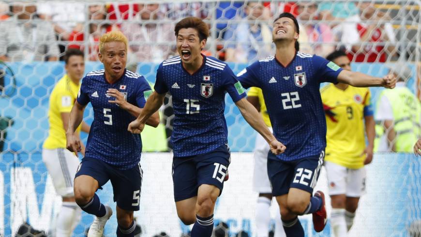 Japan’s Yuya Osako (center) celebrates with teammates after scoring the go-ahead goal in the second half against Colombia in their Group H match on Tuesday in Saransk, Russia. Japan won 2-1. Yuya Osako's second-half header gives Japan 2-1 triumph over Colombia in Group H opener