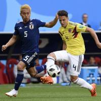 Japan’s Yuto Nagatomo (left) and Colombia’s Santiago Arias vie for the ball during their Group H match at the 2018 World Cup on Tuesday in Saransk, Russia. Japan's players well aware of Senegal's skill, discipline