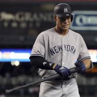 New York’s Aaron Judge walks back to the dugout after striking out in the ninth inning for the fifth time against Detroit in the second game of a doubleheader on Monday. Yankees slugger Aaron Judge whiffs a record eight times in doubleheader
