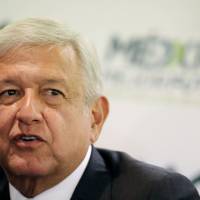 Mexican President-elect Andres Manuel Lopez Obrador speaks during a news conference after a meeting with the Business Coordinating Council (CCE) in Mexico City Wednesday. Mexico's Lopez Obrador budgets $7.5 billion to cover intern wages for jobless youths, elderly pay