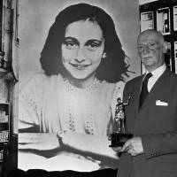 Anne Frank’s father, Otto Frank, holds the Golden Pan award, given for the sale of 1 million copies of the paperback of “The Diary of Anne Frank,” in London on June 14, 1971. Anne Frank's family tried to escape to U.S., documents show, but were thwarted by visa restrictions