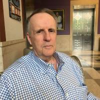 John Ryan, seen June 21 at the Sidney Kimmel Cancer Center at the Johns Hopkins hospital in Baltimore, was diagnosed with lung cancer in June 2013 and was recruited for a clinical trial of an immunotherapy drug. 'Slow but sure' progress toward less toxic tools to fight cancer