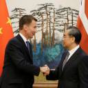British Foreign Secretary Jeremy Hunt shakes hands with China's top diplomat, State Councillor Wang Yi, after a joint news conference at the Diaoyutai State Guesthouse in Beijing on Monday.
