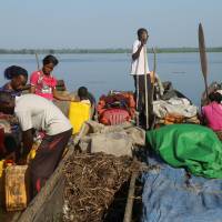 Traders offload beans and jerrycans from their boats on the Congo River during the vaccination campaign against Ebola in the port city of Mbandaka, Democratic Republic of Congo, May 23. Congo’s Ebola scare is over but a new one may have surfaced in Sierra Leone. New Ebola virus found in bats in Sierra Leone; too soon to tell if it spreads to humans